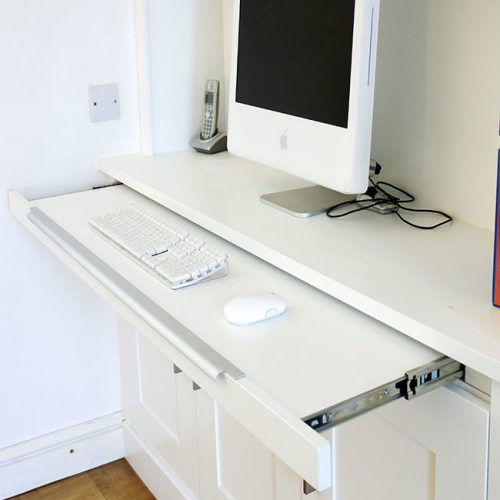 Home office workstation in an alcove cupboard