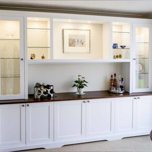 Large living room built in cupboards with glazed door display cabinets