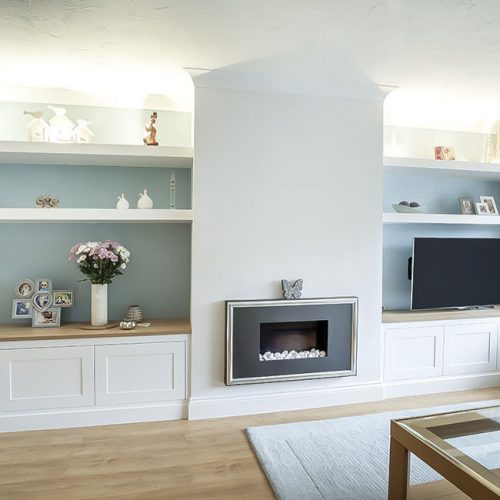 white painted lounge furniture with floating shelves