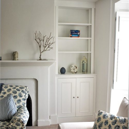 alcove unit with traditional styled framed cabinet fitted up to ceiling. Moulded doors with a simple panel bead, Painted in White eggshell