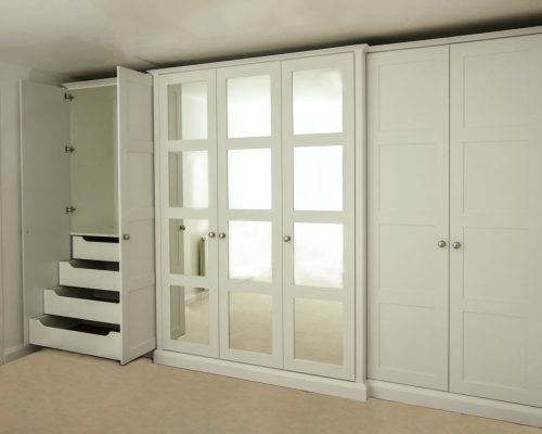 Wall-to-wall-shaker-wardrobe-with-mirrors-and-Break fornt