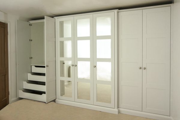 Wall-to-wall-shaker-wardrobe-with-mirrors-and-Break fornt