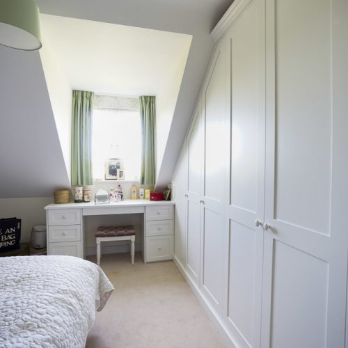 modern fitted wardrobe in bedroom