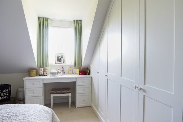 Modern fitted Shaker wardrobe in bedroom