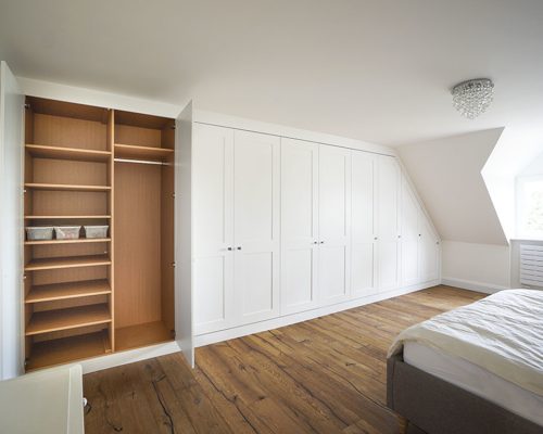 wall to wall white shaker built in wardrobe