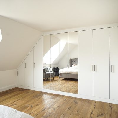 modern wall to wall fitted wardrobe wit mirrors